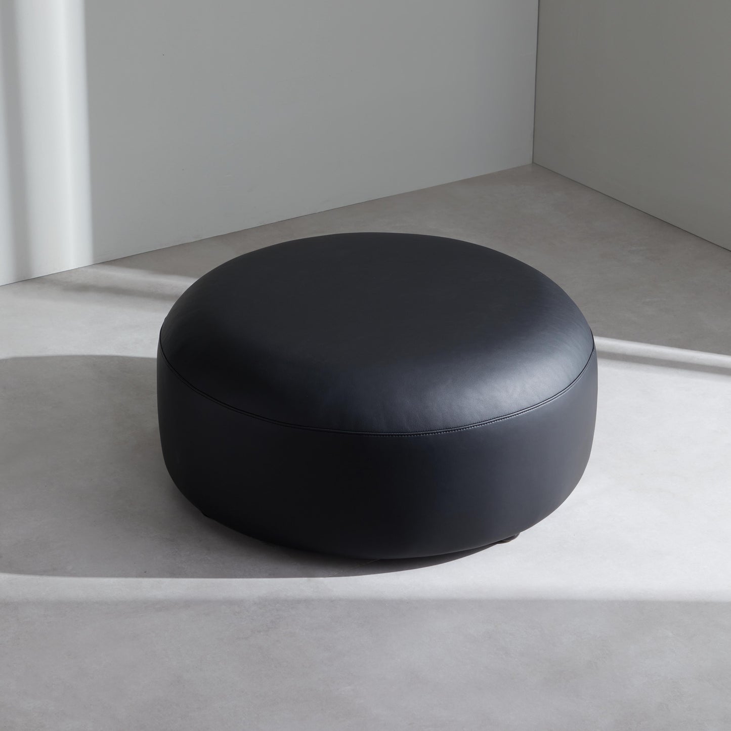 Monolith Round Black Leather Ottoman-Black