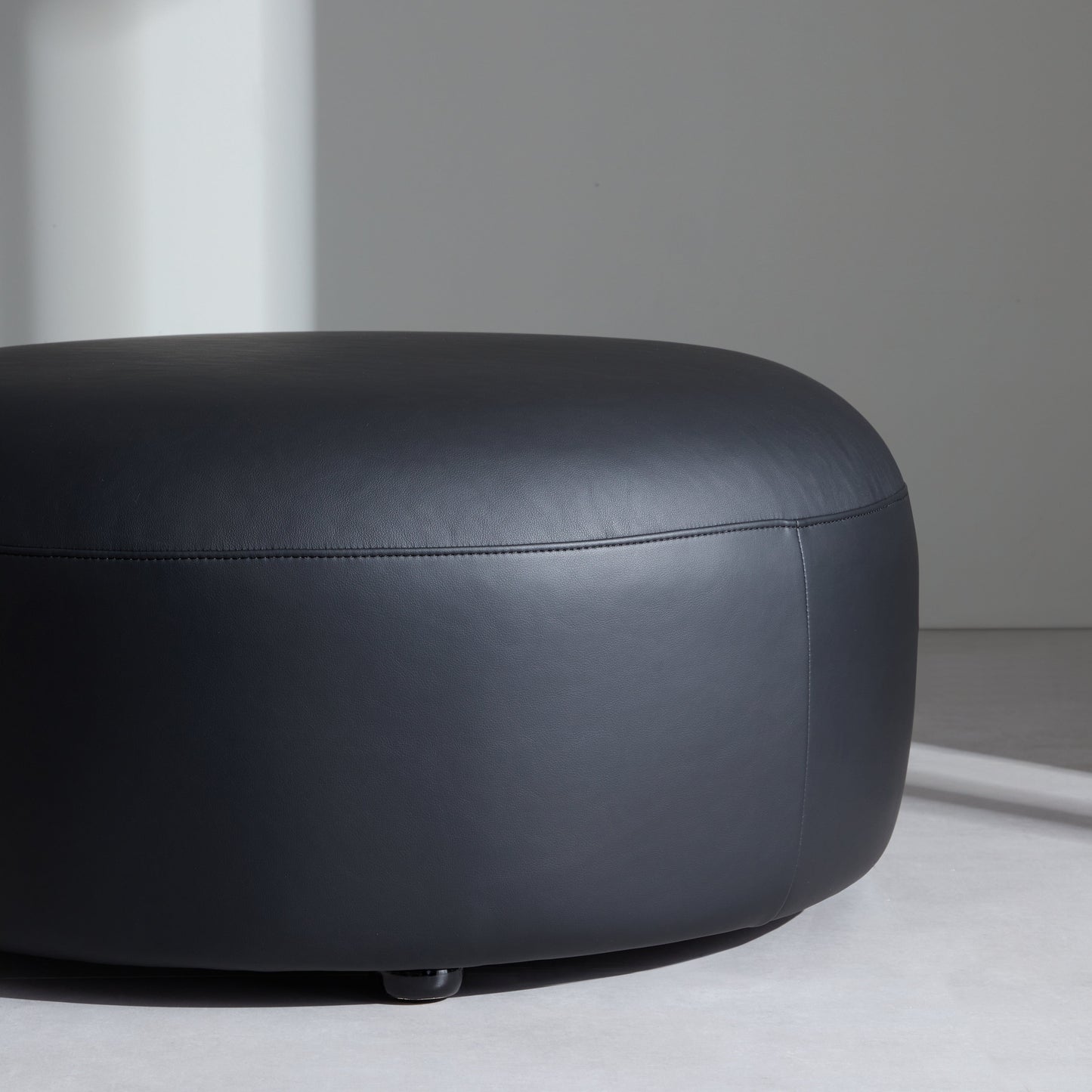Monolith Round Black Leather Ottoman-Black