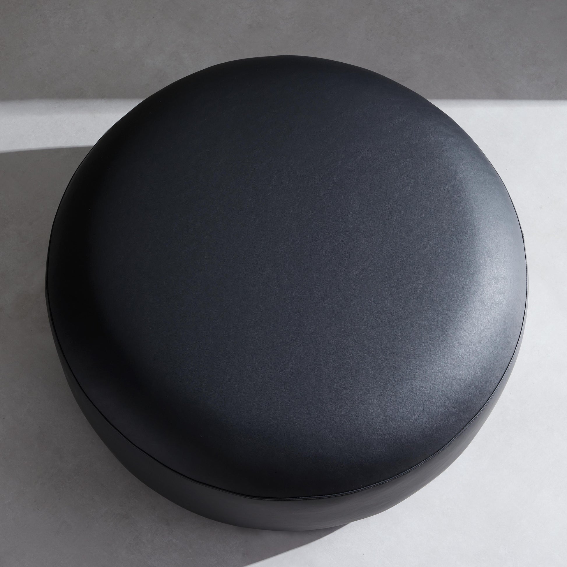 Monolith Round Black Leather Ottoman-Black