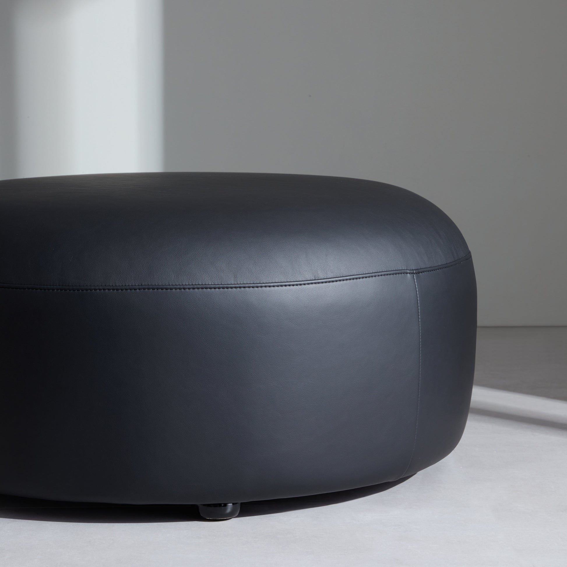 Monolith Round Black Leather Ottoman-Black
